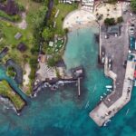 Aerial view of the historic Kailua-Kona town old harbour area on a sunny and partly cloudy day on the Big Island of Hawaii, USA — Grand Wailea Partners with Hawaii Celebrity for New Menu Item Launch | Maui Tom's News