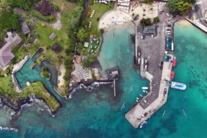 Aerial view of the historic Kailua-Kona town old harbour area on a sunny and partly cloudy day on the Big Island of Hawaii, USA β Grand Wailea Partners with Hawaii Celebrity for New Menu Item Launch | Maui Tom's News