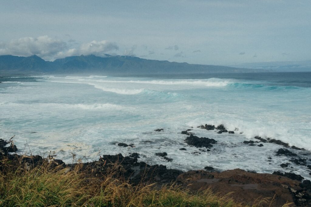 a view of a body of water with mountains in the background — High Surf Advisory Issued for South-Facing Shores Through Weekend | Maui Tom's News