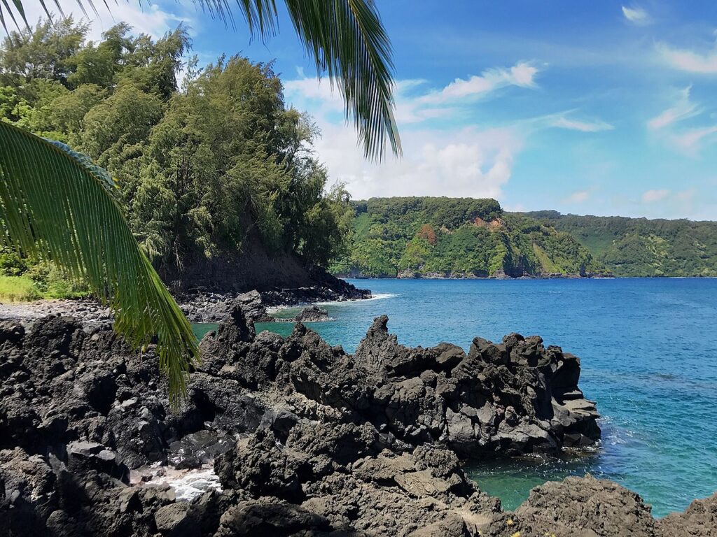 Black rock beach in Maui, HI USA along the Road to Hana — HTA Releases 2026–28 Tourism Management Plans Targeting Stressed Hotspots | Maui Tom's News