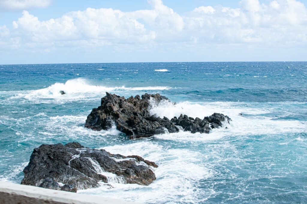 Waves crashing into lava rock formations along the coastline on the Road to Hana in Maui, Hawaii. — Piiholo Road Reopens After Temporary Closure | Maui Tom's News