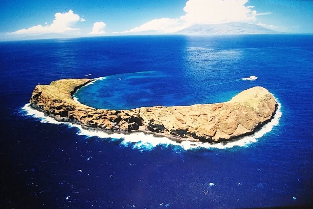 Molokini island Maui crescent shape — Hawaii Tests Artificial Reef to Shield Coastal Roads from Wave Damage | Maui Tom's News